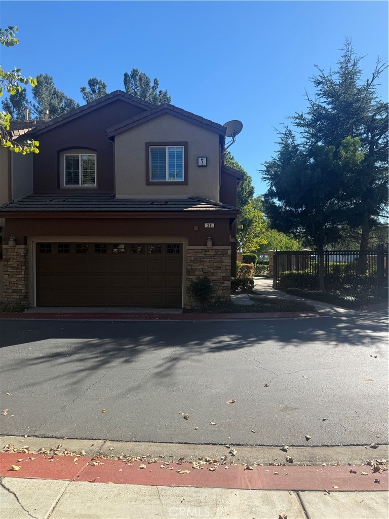 8692 East 9th Street, Unit 38 Rancho Cucamonga, CA 91730 - Photo 5 of 31 a view of a house with a yard