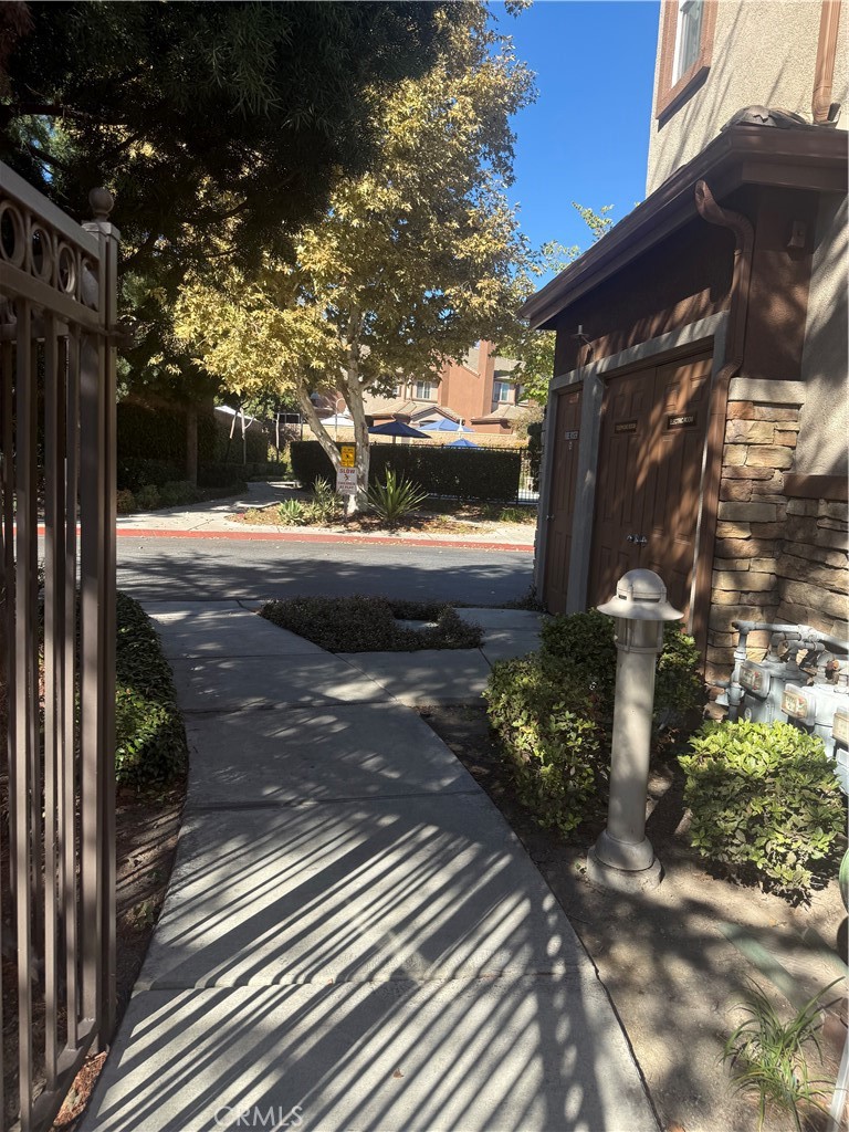 8692 East 9th Street, Unit 38 Rancho Cucamonga, CA 91730 - Photo 9 of 31 a view of a house with a yard