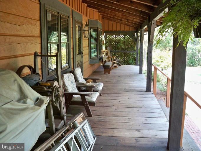 11902 Beaver Dam Road Union Bridge, MD 21791 - Photo 2 of 25 a view of a patio with table and chairs and wooden floor