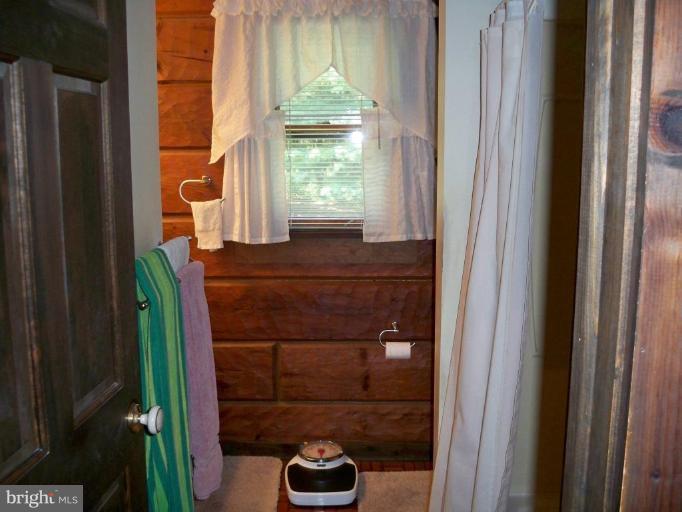 11902 Beaver Dam Road Union Bridge, MD 21791 - Photo 16 of 25 a bathroom with a sink and a mirror