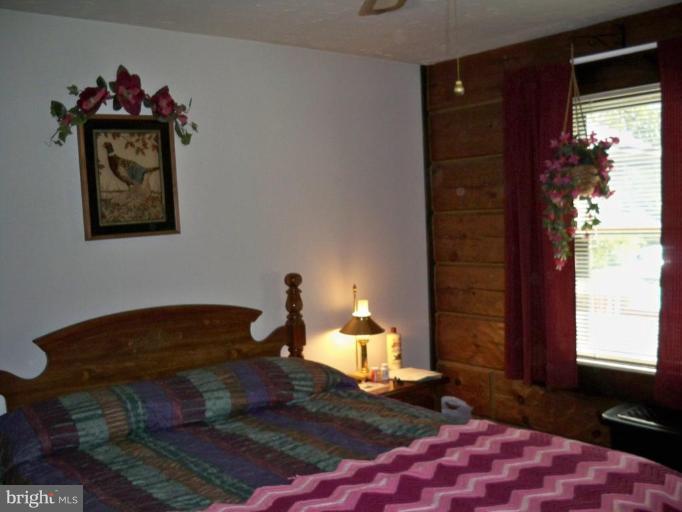 11902 Beaver Dam Road Union Bridge, MD 21791 - Photo 19 of 25 a bedroom with a bed and a window