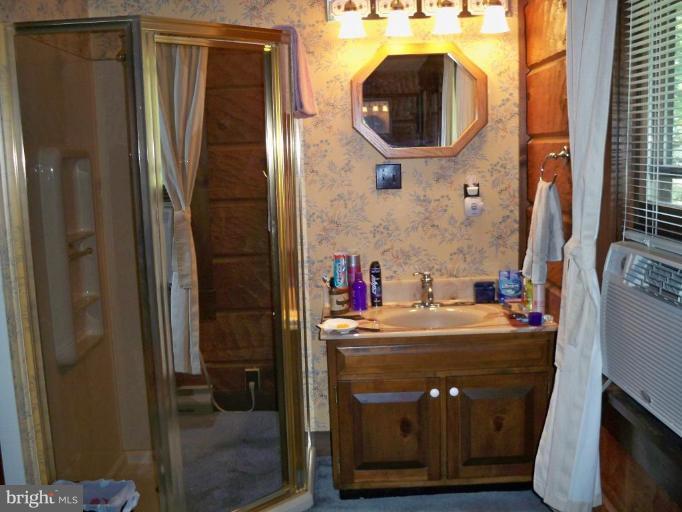 11902 Beaver Dam Road Union Bridge, MD 21791 - Photo 21 of 25 a bathroom with a sink vanity and mirror