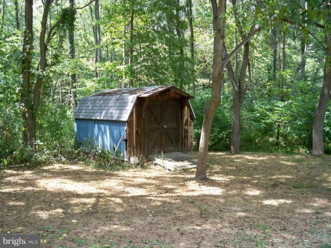 11902 Beaver Dam Road Union Bridge, MD 21791 - Photo 24 of 25 a view of a barn in the middle of a yard