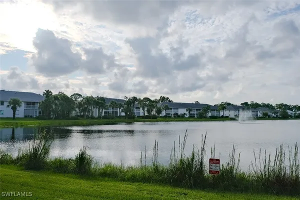 a view of a lake with houses in background