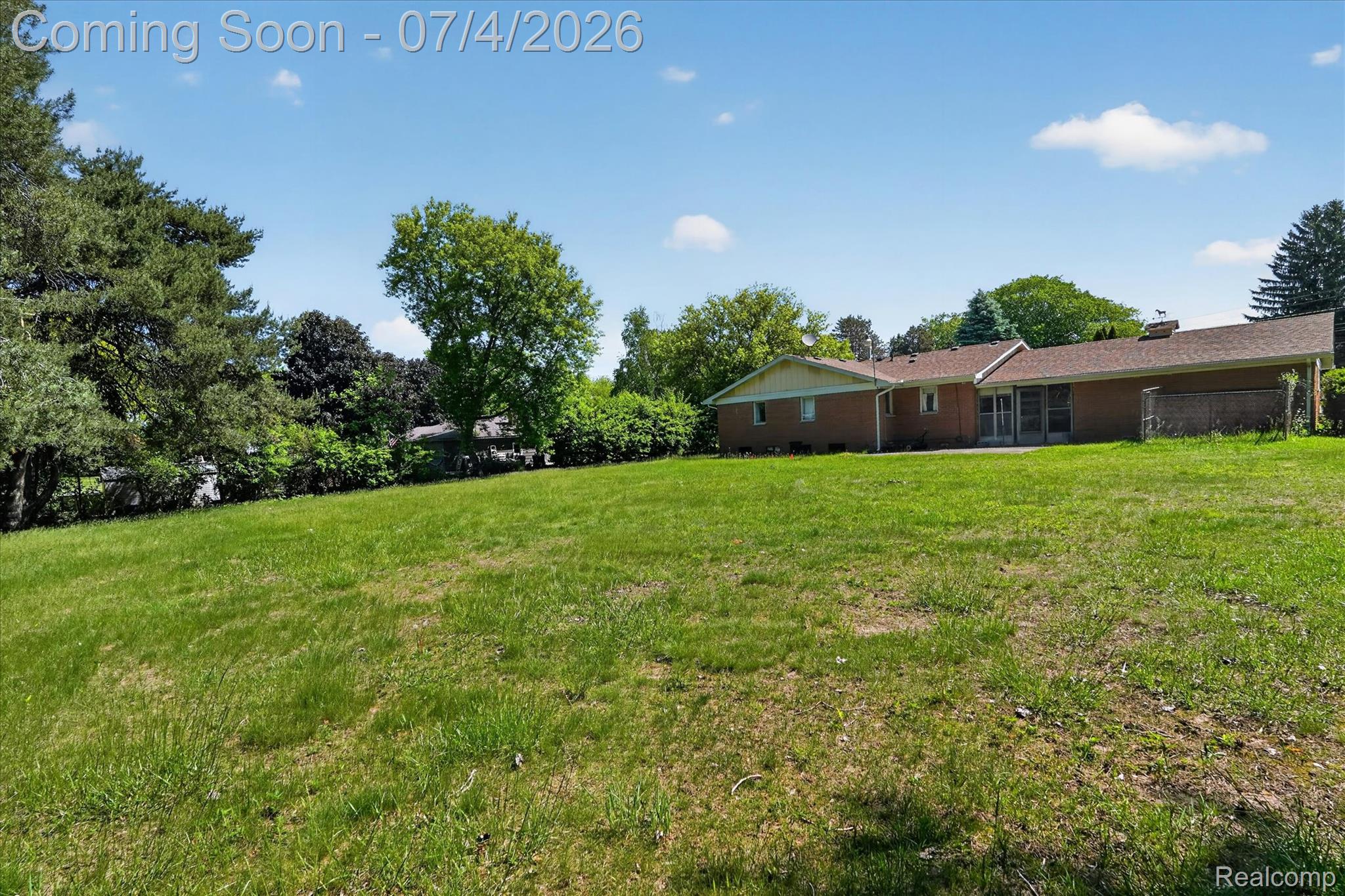 2091 North Irish Road Davison, MI 48423 - Photo 21 of 25 Expansive green lawn with mature trees bordering the property