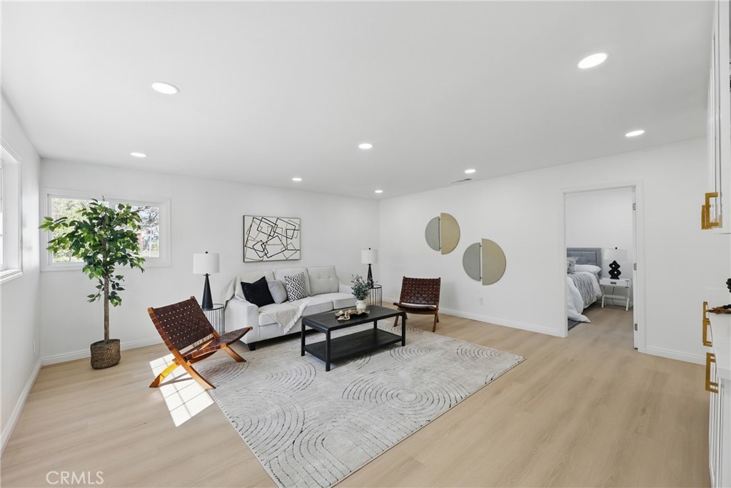 9431 Cypress Avenue Riverside, CA 92503 - Photo 14 of 40 a living room with furniture and a potted plant