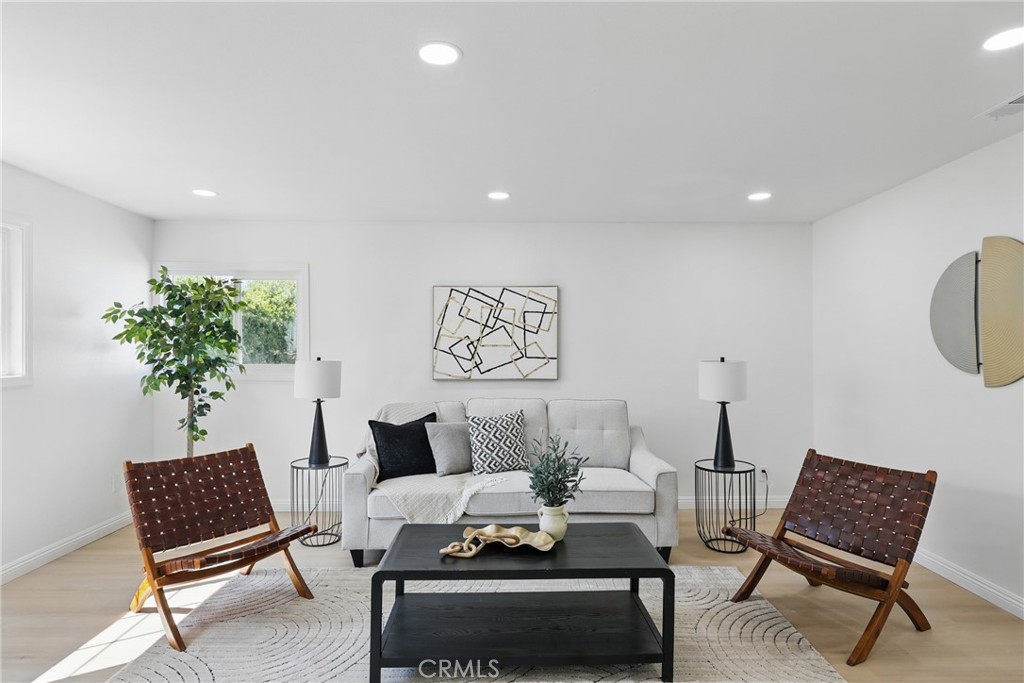 9431 Cypress Avenue Riverside, CA 92503 - Photo 15 of 40 a living room with furniture and a potted plant