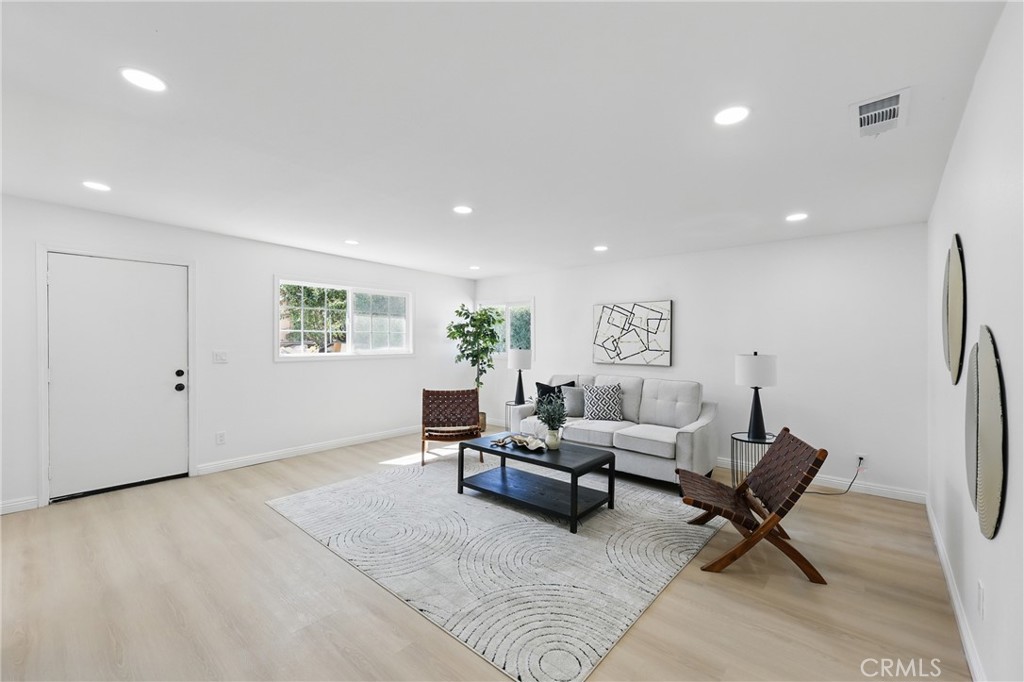 9431 Cypress Avenue Riverside, CA 92503 - Photo 16 of 40 a living room with furniture and a rug