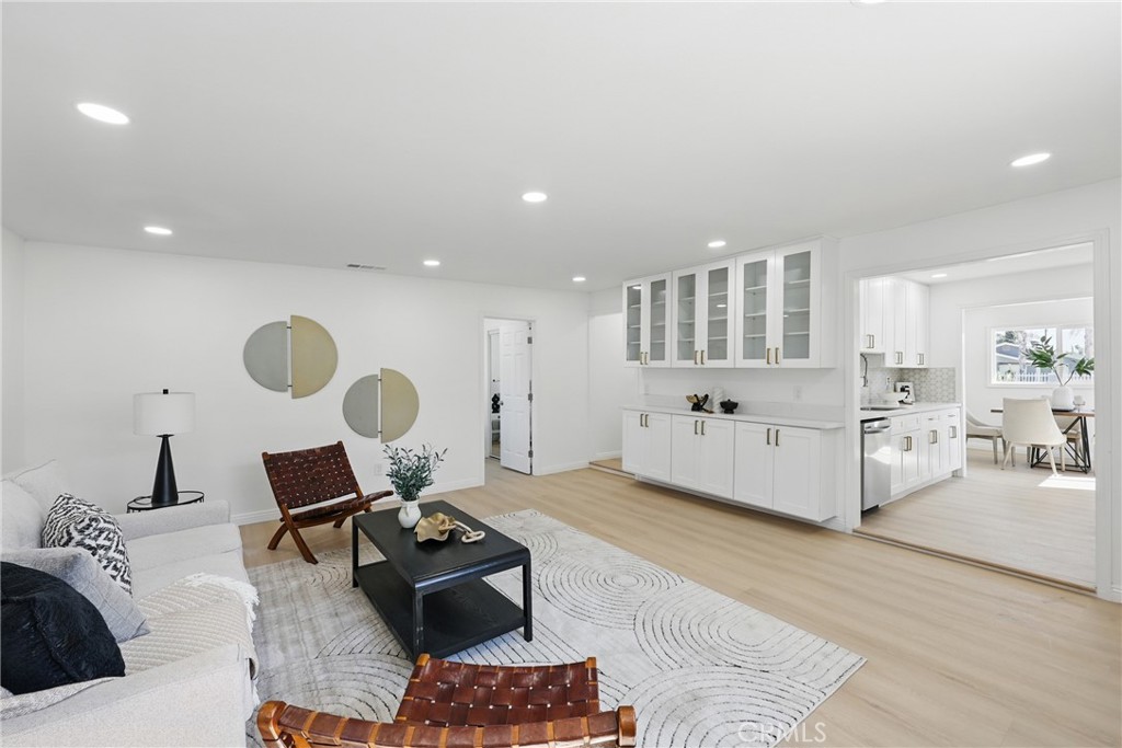 9431 Cypress Avenue Riverside, CA 92503 - Photo 18 of 40 a living room with furniture and a wooden floor