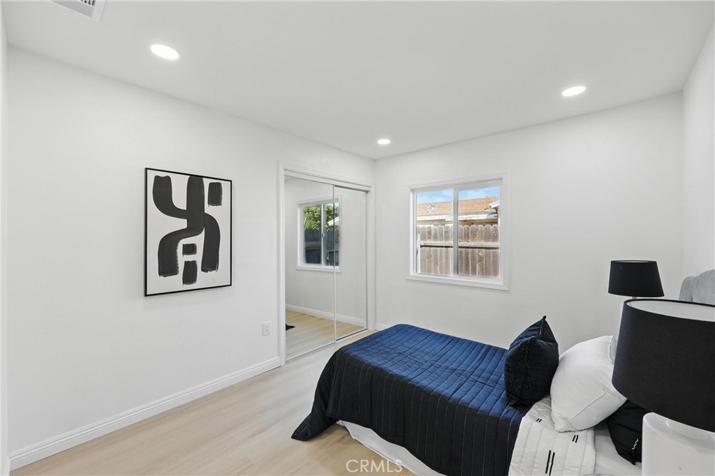 9431 Cypress Avenue Riverside, CA 92503 - Photo 22 of 40 a bedroom with a bed and a couch