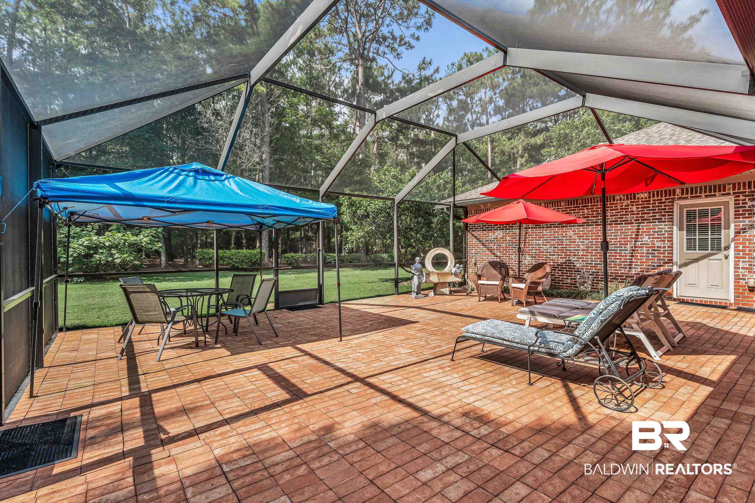 7014 Blakeley Road Daphne, AL 36527 - Photo 15 of 45 Expansive screened patio featuring brick paver flooring and a red brick exterior wall