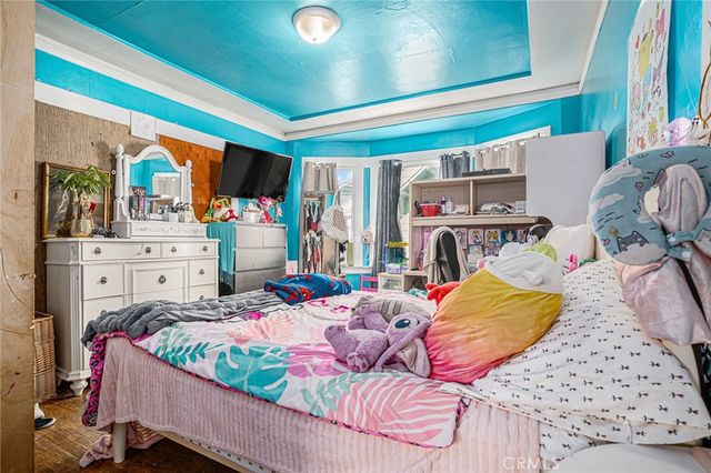 a bed room with a bed and a chair