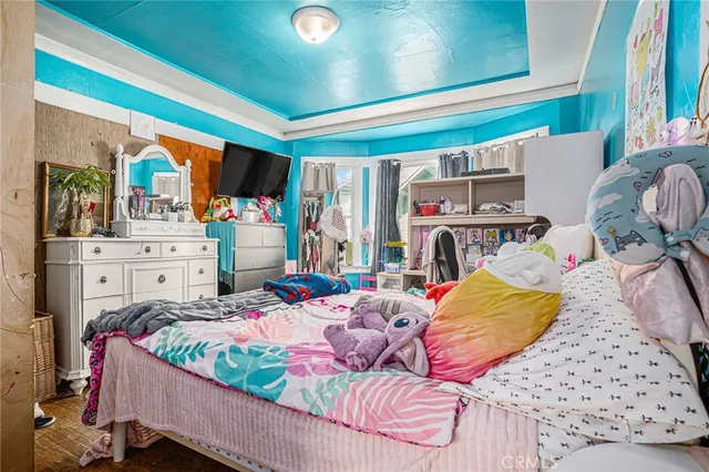 a bed room with a bed and a chair