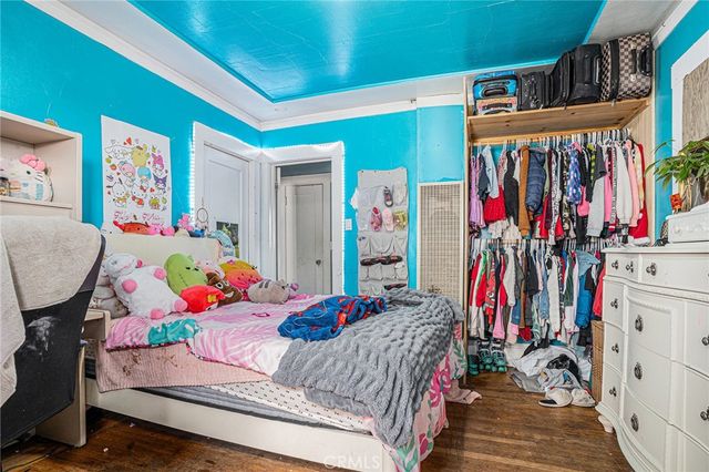 a bedroom with furniture and a bed