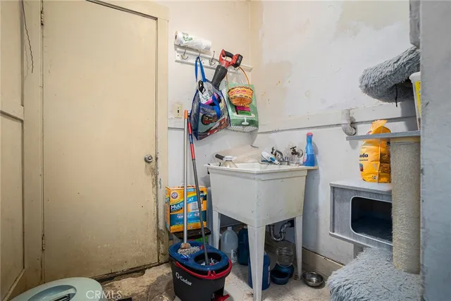 a view of a hallway with washer and dryer