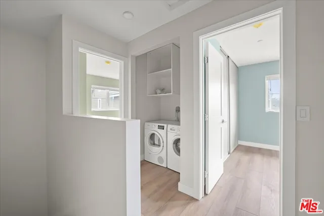 a view of hallway with wooden floor