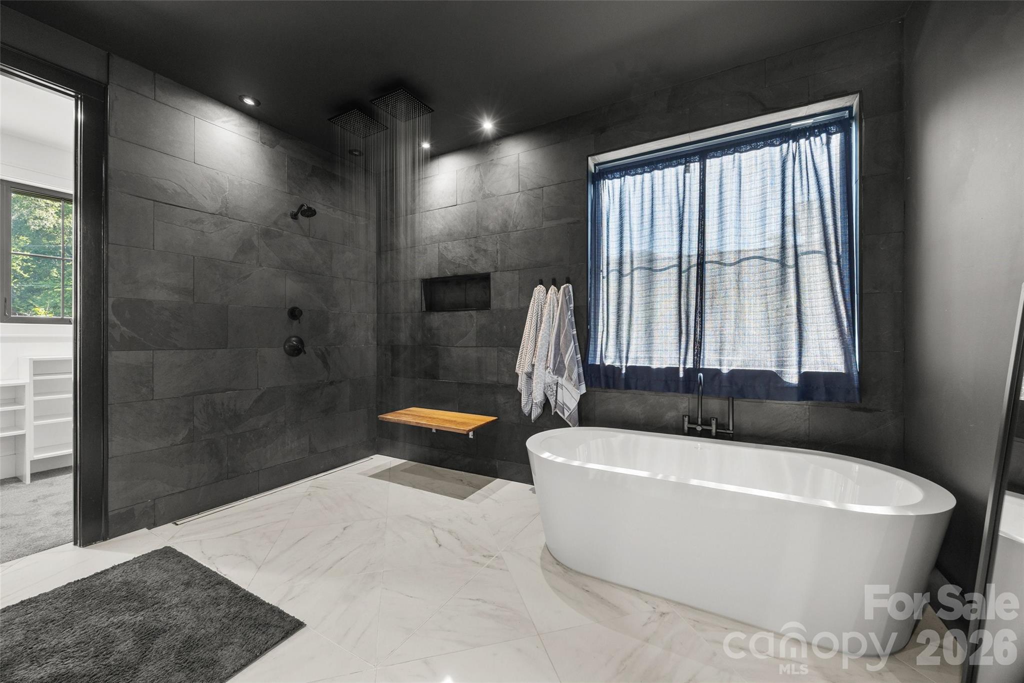 5438 Ralph Harper Lane Clover, SC 29710 - Photo 19 of 28 a bathroom with a tub a toilet and a shower
