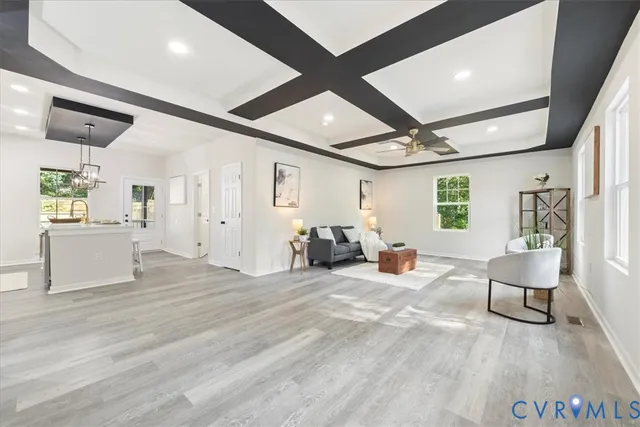 a view of a livingroom with furniture and windows