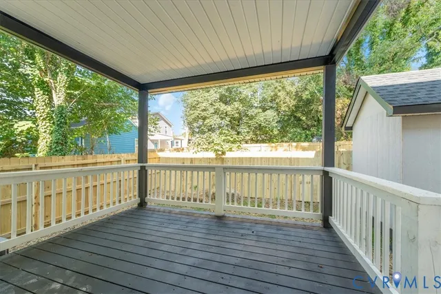 a view of balcony with wooden floor