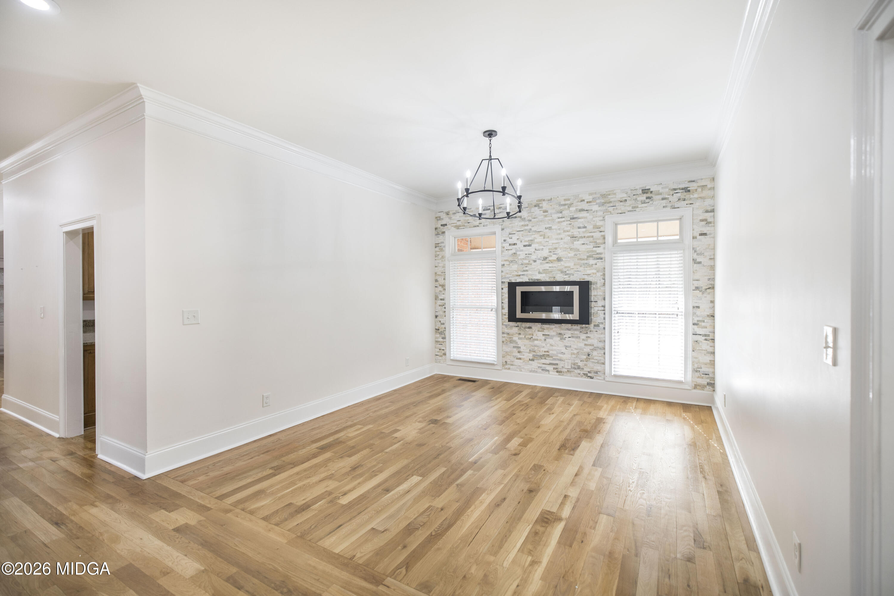 720 Latrobe Way Macon, GA 31220 - Photo 11 of 52 a view of a livingroom with wooden floor and a fireplace
