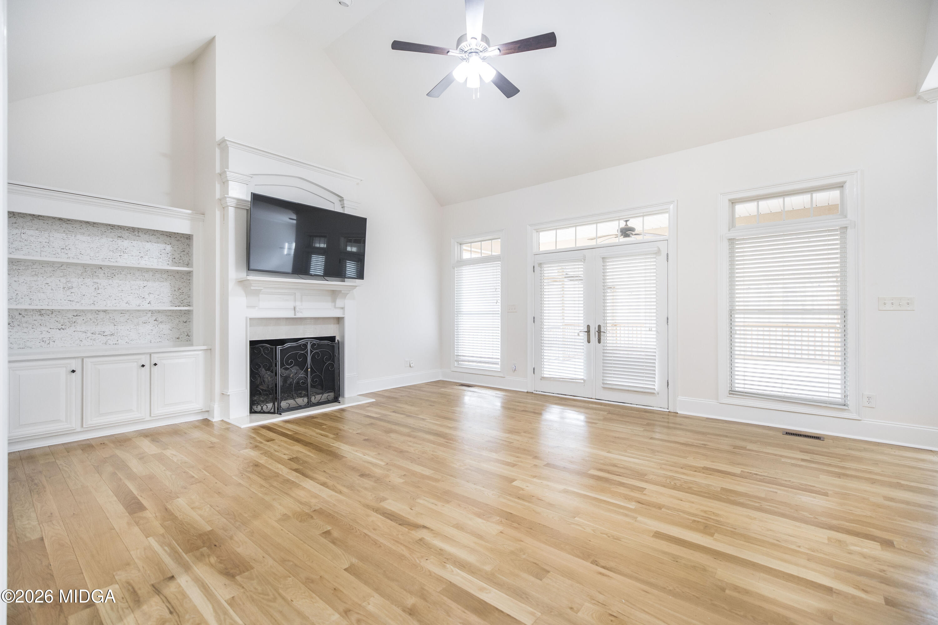 720 Latrobe Way Macon, GA 31220 - Photo 14 of 52 a view of empty room with wooden floor and fireplace