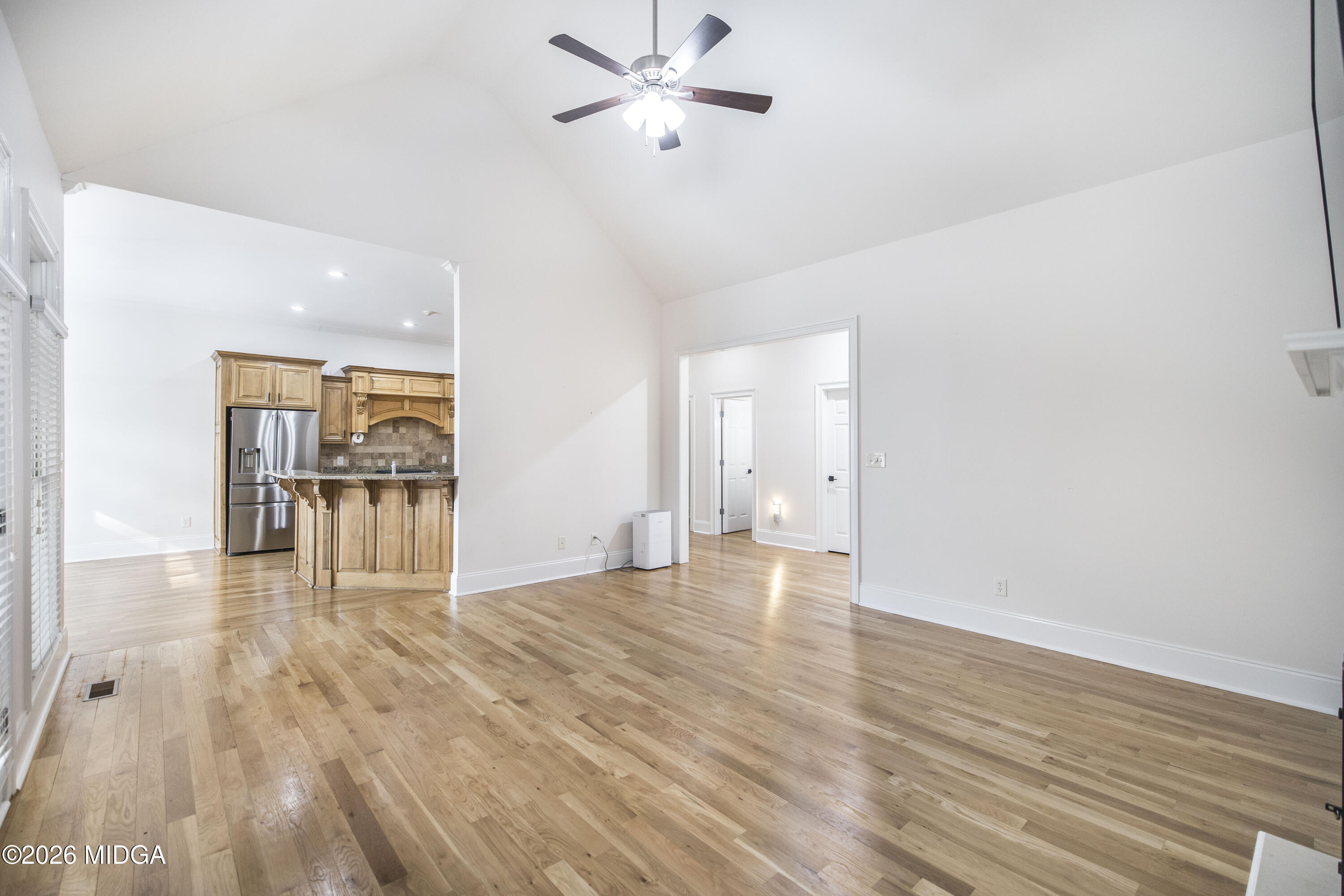 720 Latrobe Way Macon, GA 31220 - Photo 15 of 52 a view of a livingroom with wooden floor and a ceiling fan