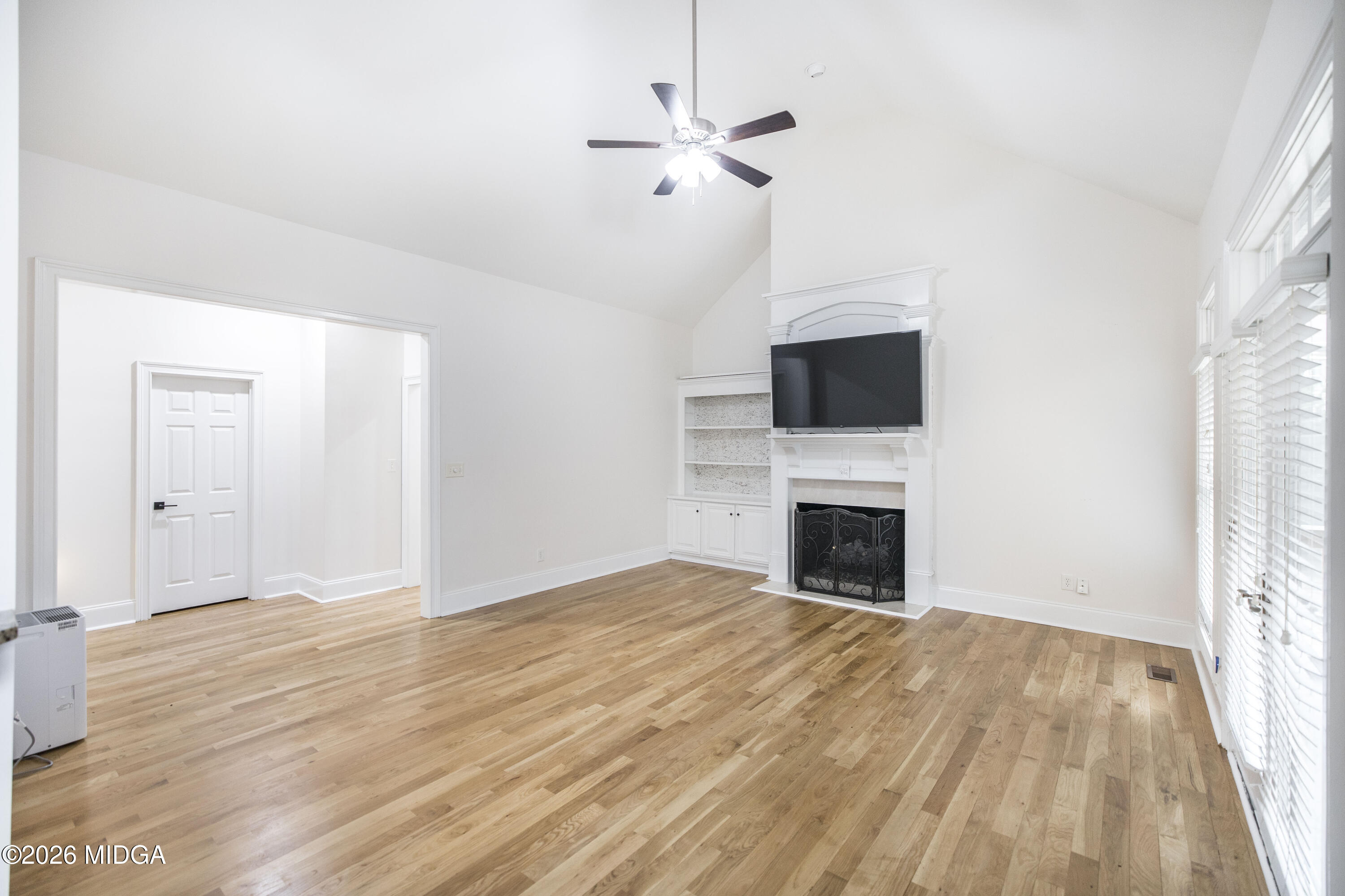 720 Latrobe Way Macon, GA 31220 - Photo 16 of 52 a view of empty room with fireplace and wooden floor