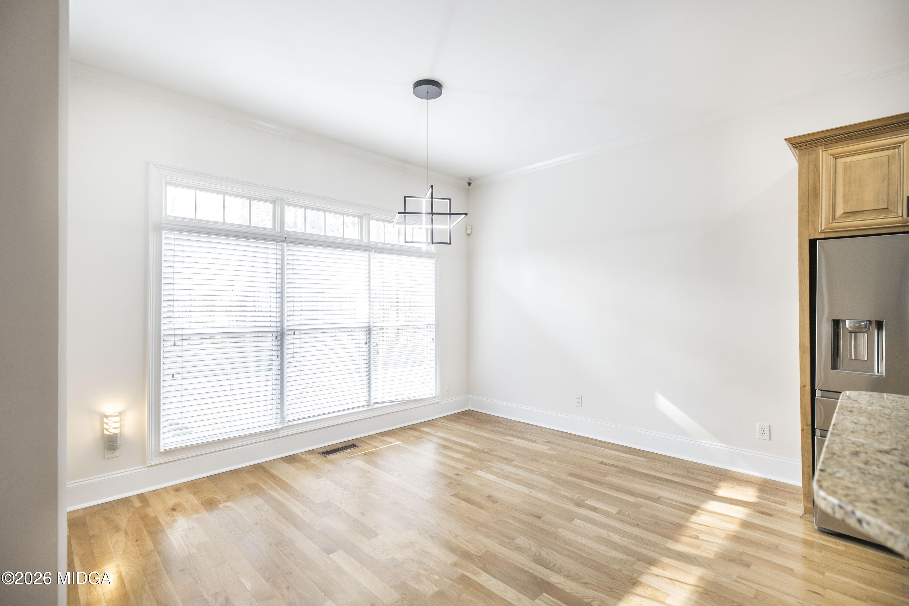 720 Latrobe Way Macon, GA 31220 - Photo 17 of 52 a view of an empty room with wooden floor and a window