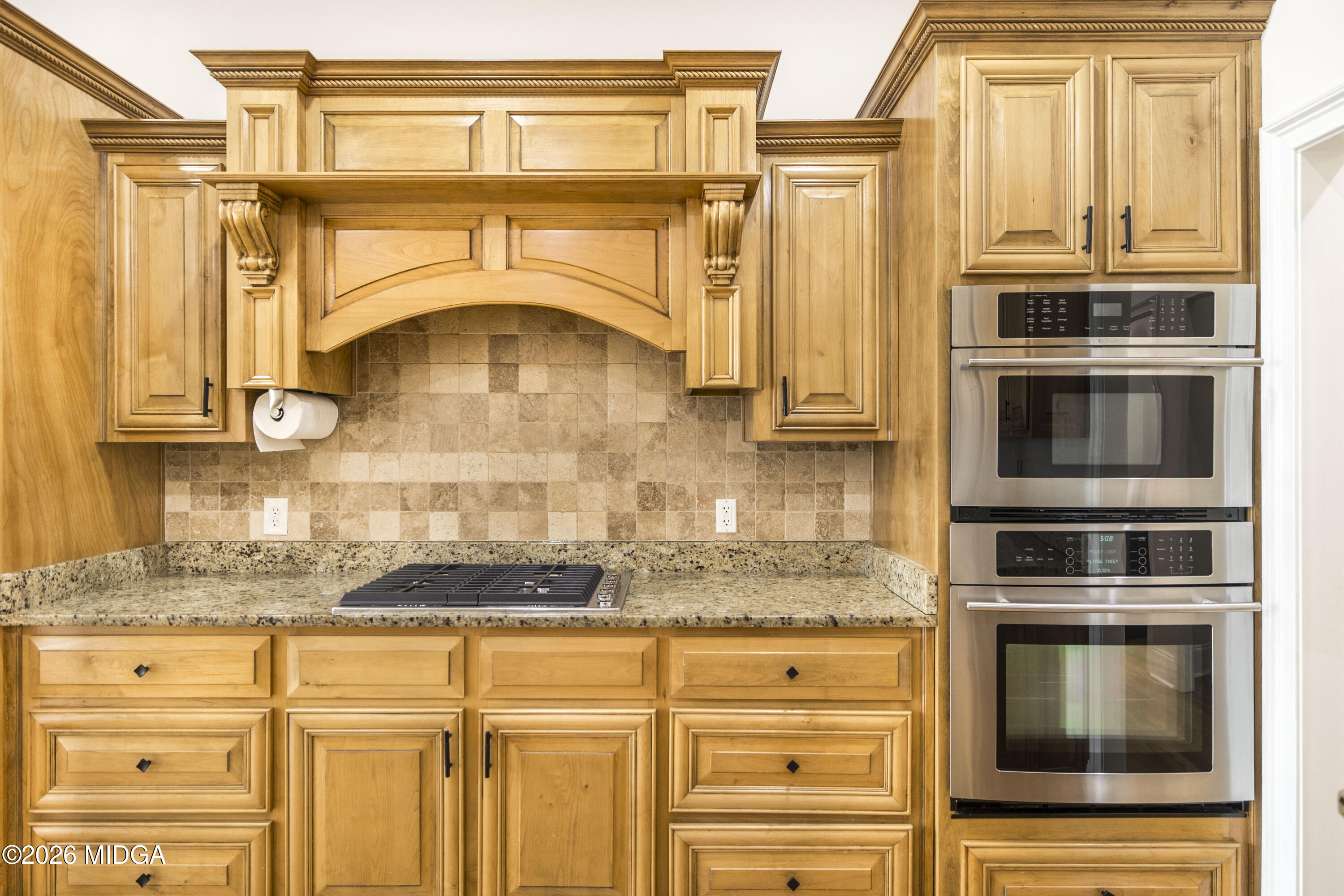 720 Latrobe Way Macon, GA 31220 - Photo 20 of 52 a kitchen with stainless steel appliances granite countertop a stove and a microwave