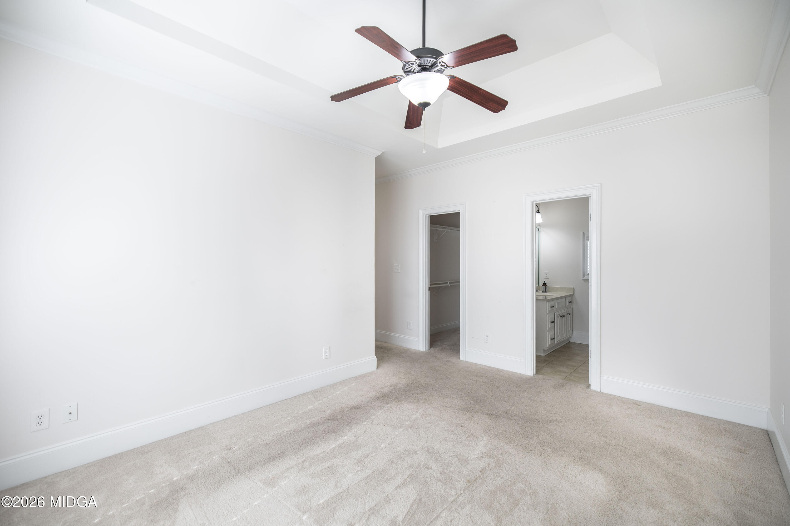 720 Latrobe Way Macon, GA 31220 - Photo 27 of 52 an empty room with a ceiling fan and a window