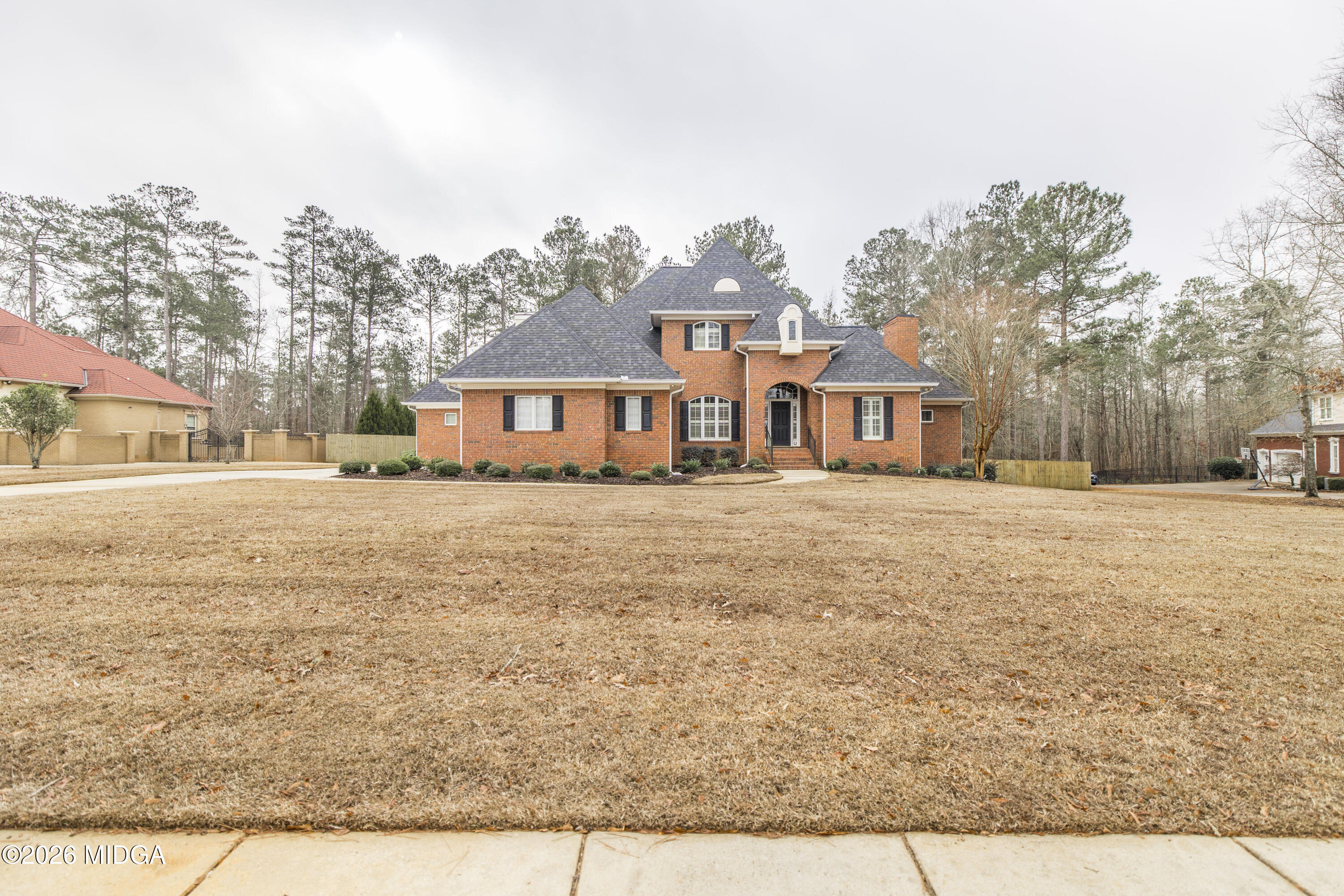 720 Latrobe Way Macon, GA 31220 - Photo 3 of 52 a front view of a house with a yard