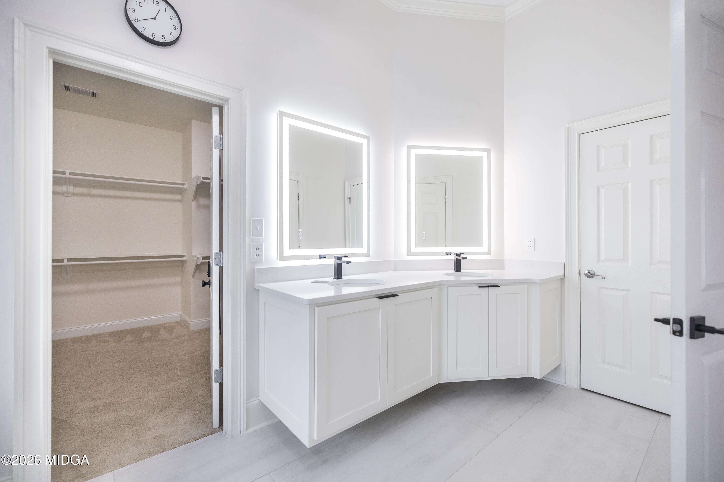720 Latrobe Way Macon, GA 31220 - Photo 31 of 52 a bathroom with a double vanity sink and mirror