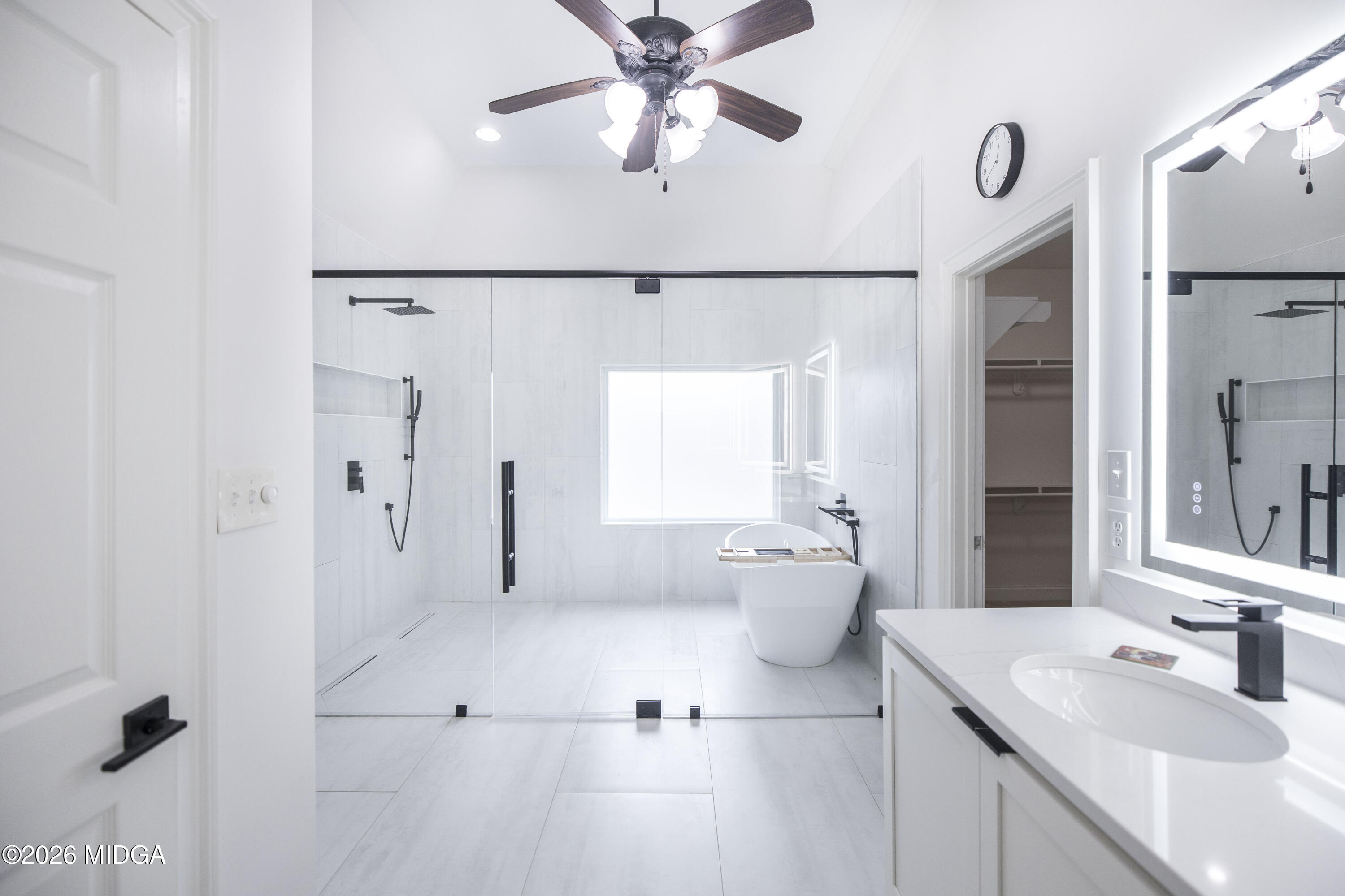 720 Latrobe Way Macon, GA 31220 - Photo 32 of 52 a spacious bathroom with a double vanity sink a mirror and shower