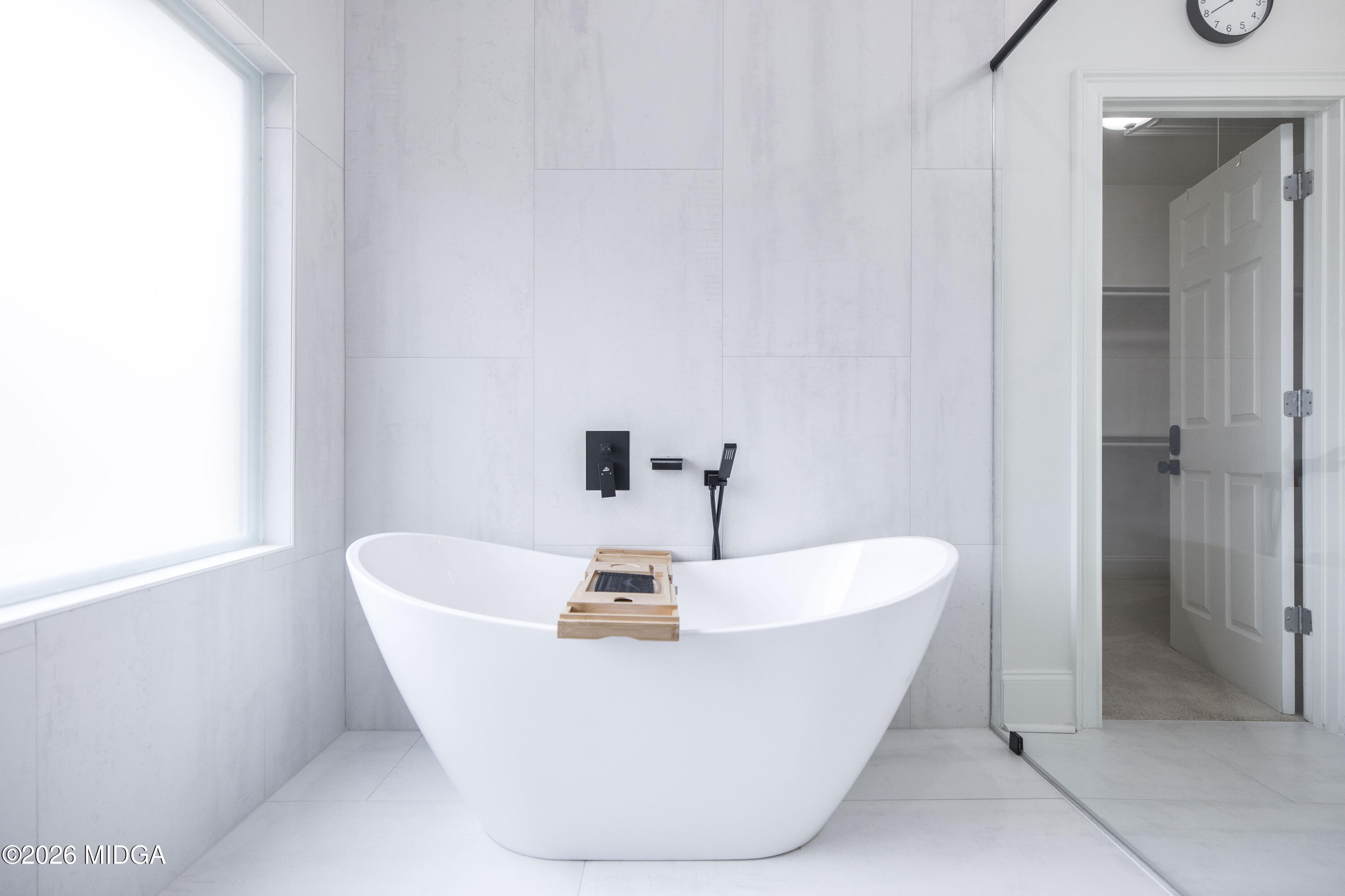 720 Latrobe Way Macon, GA 31220 - Photo 34 of 52 a white bath tub sitting in a bathroom