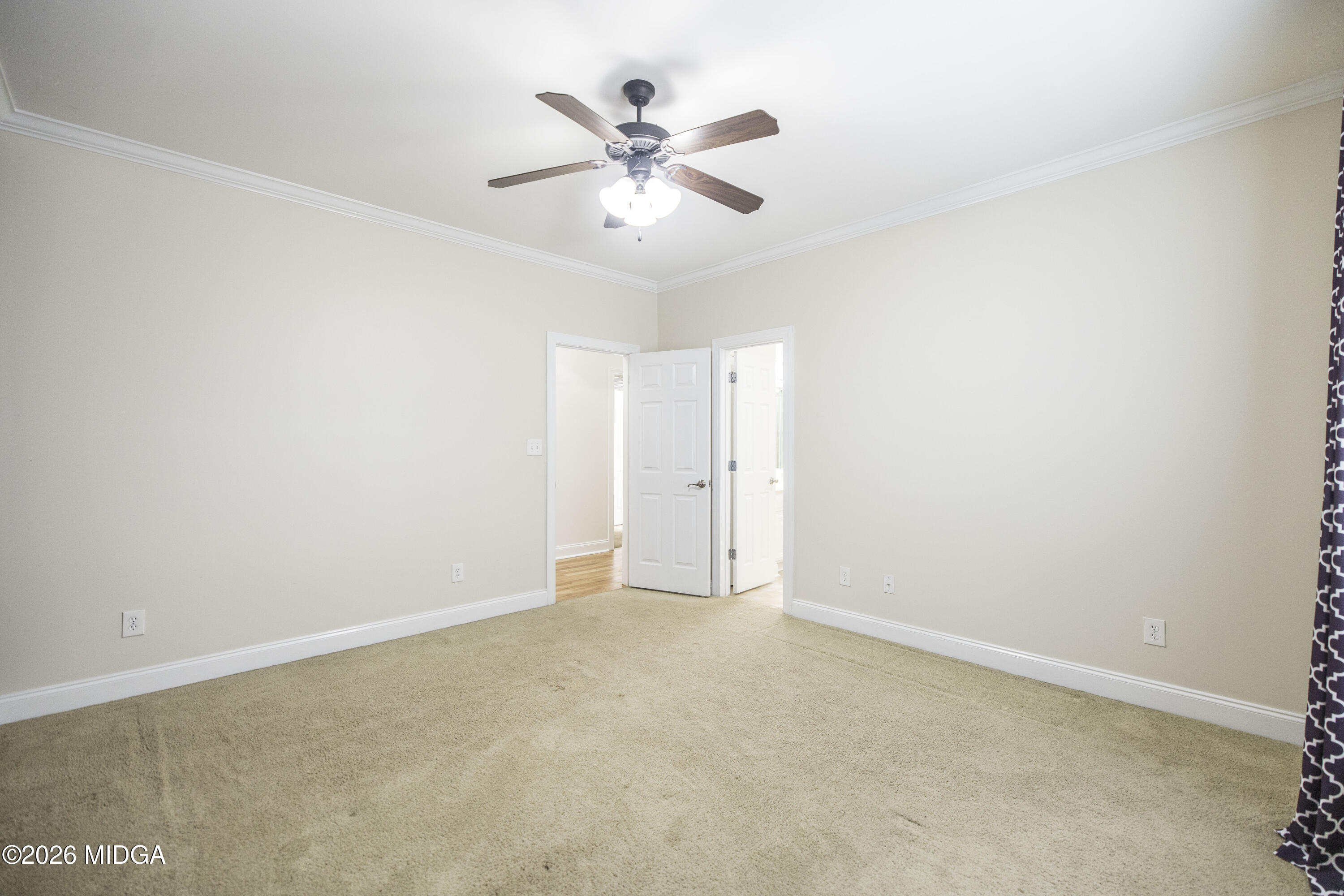 720 Latrobe Way Macon, GA 31220 - Photo 40 of 52 an empty room with closet and ceiling fan