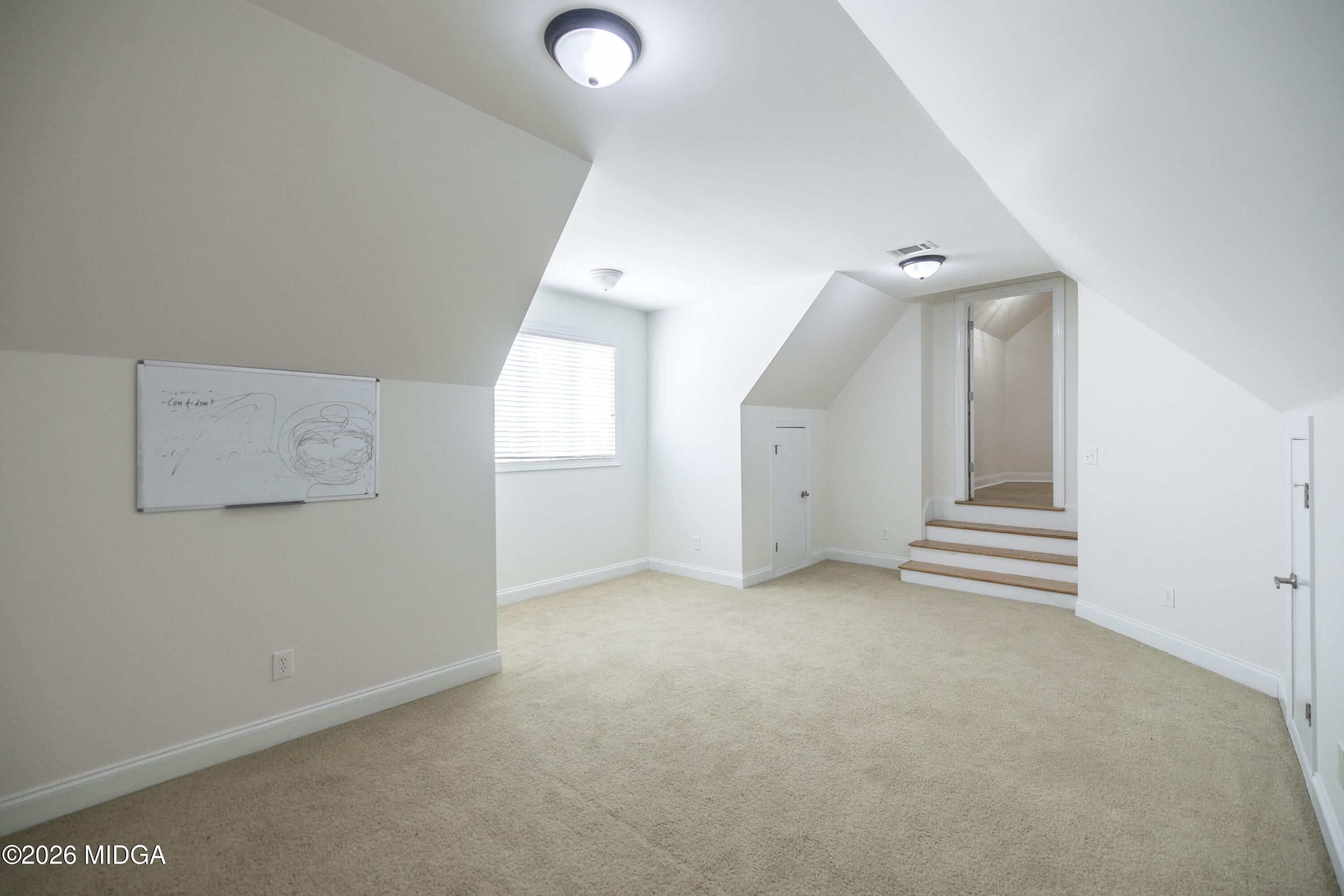 720 Latrobe Way Macon, GA 31220 - Photo 47 of 52 an empty room with a hallway and white walls
