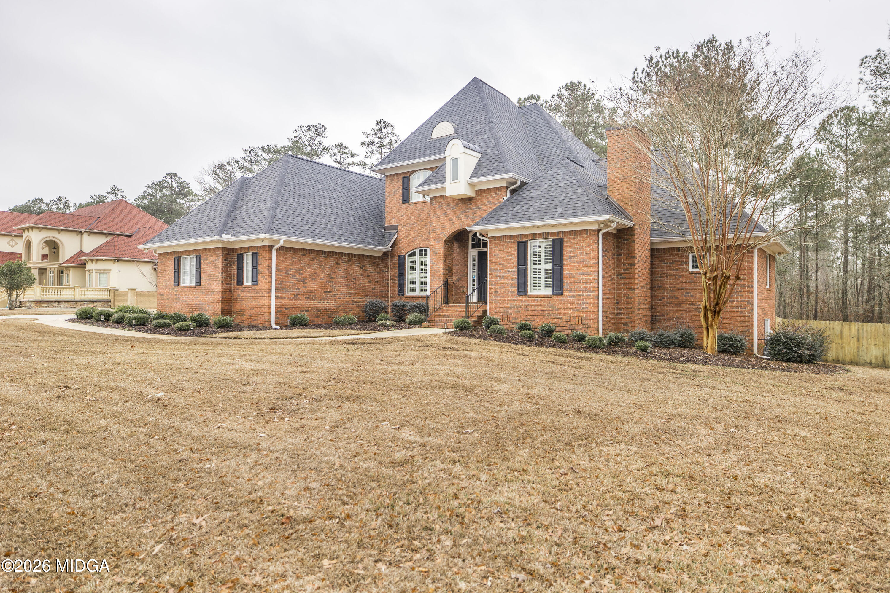 720 Latrobe Way Macon, GA 31220 - Photo 5 of 52 front view of a house next to a yard