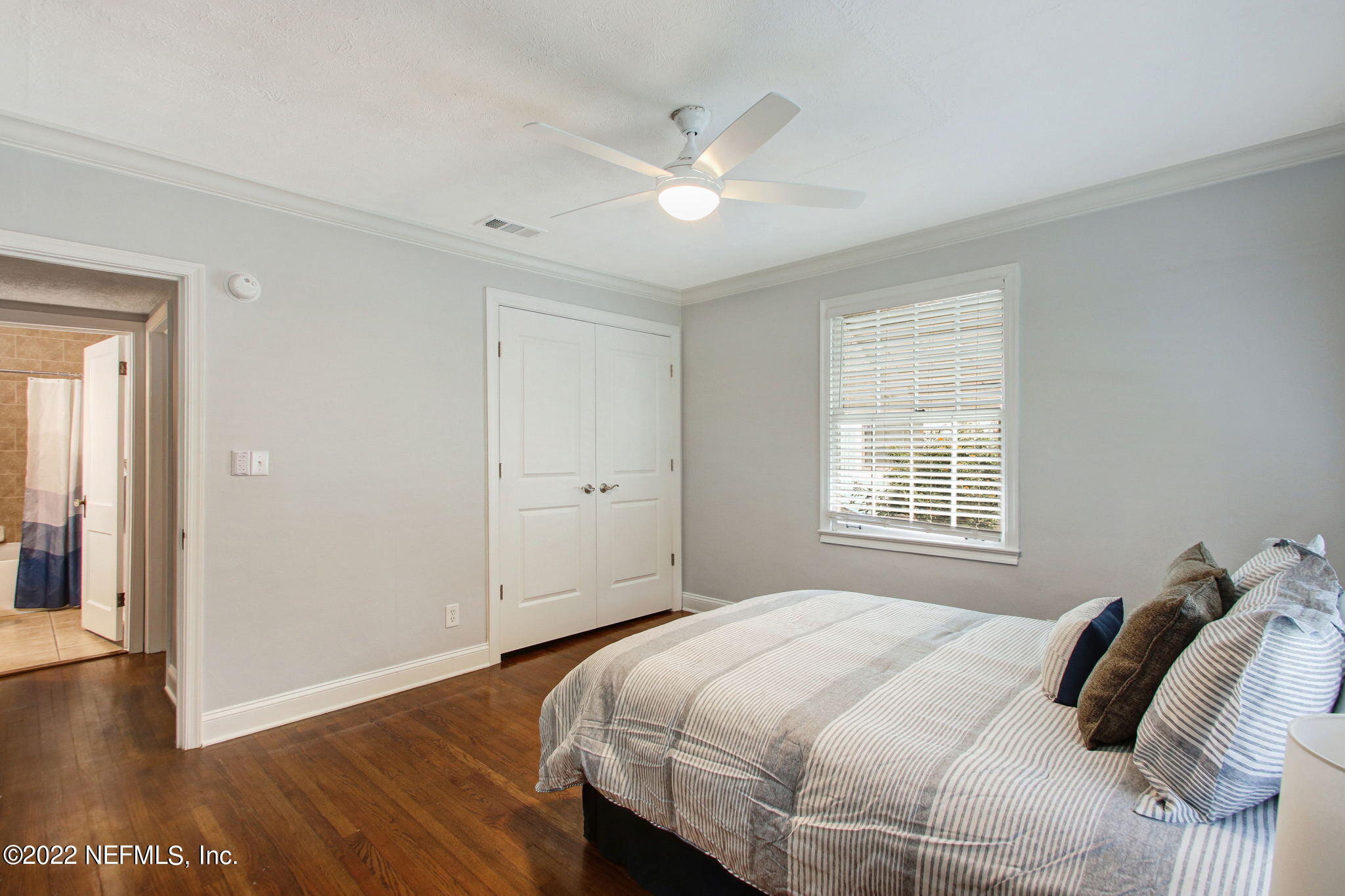 1743 Planters Road Jacksonville, FL 32207 - Photo 18 of 29 a bedroom with a bed and a window
