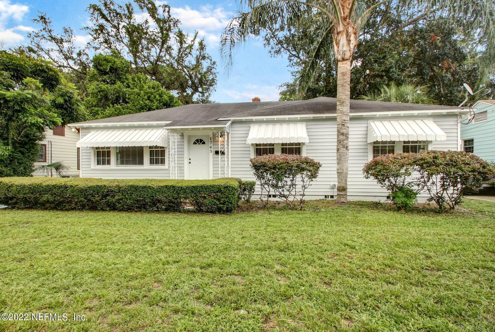 1743 Planters Road Jacksonville, FL 32207 - Photo 2 of 29 a front view of house with yard and trees