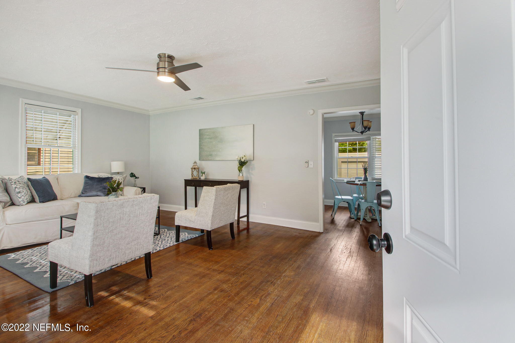 1743 Planters Road Jacksonville, FL 32207 - Photo 4 of 29 a living room with furniture and a wooden floor