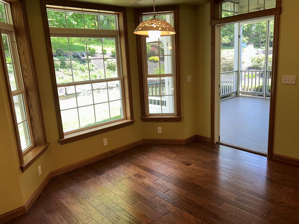 114 Oak Ridge Drive Clarion, PA 16214 - Photo 13 of 38 a view of an empty room with wooden floor and a window