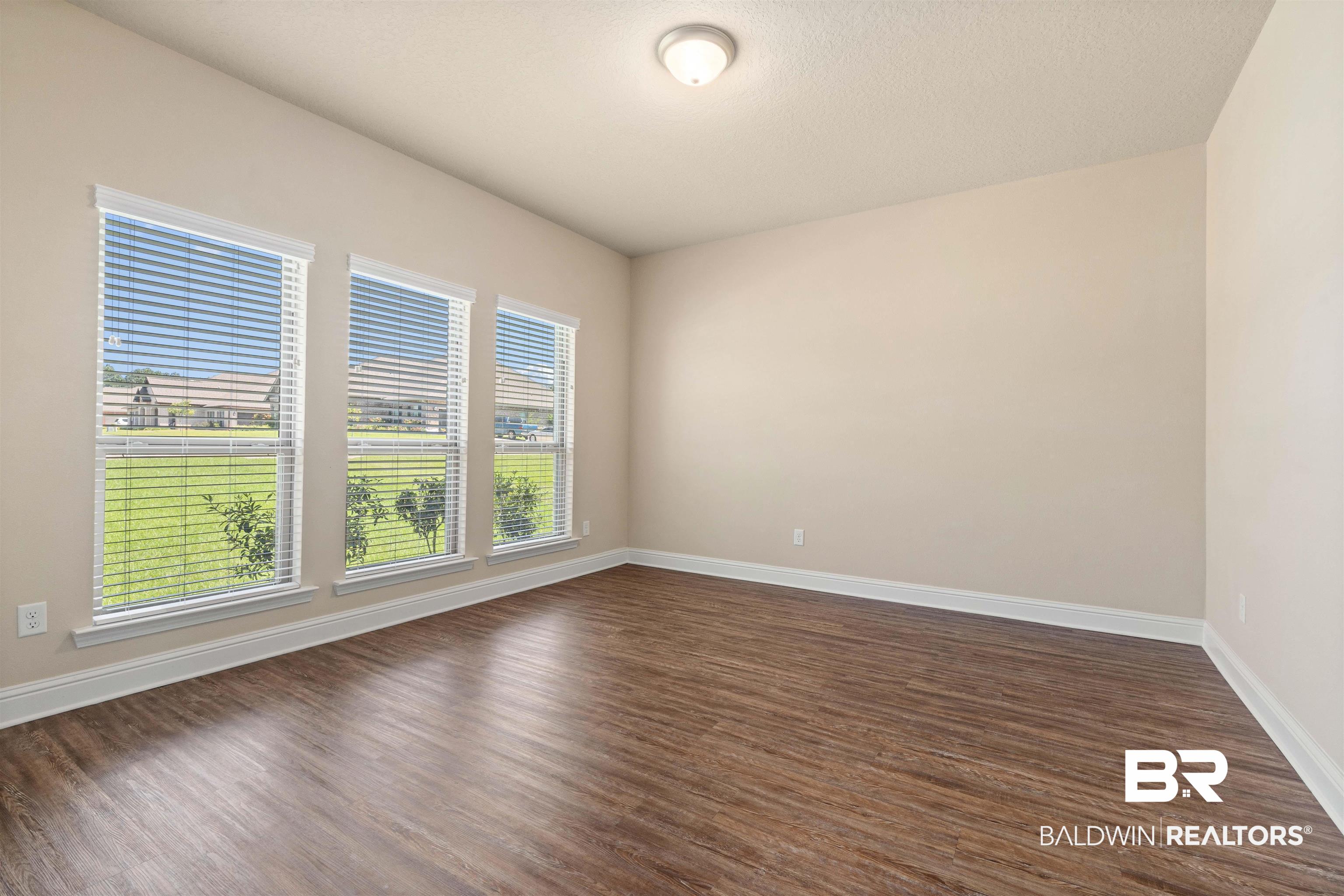 1864 Gwin Court Mobile, AL 36695 - Photo 18 of 37 Unfurnished room featuring dark hardwood / wood-style flooring