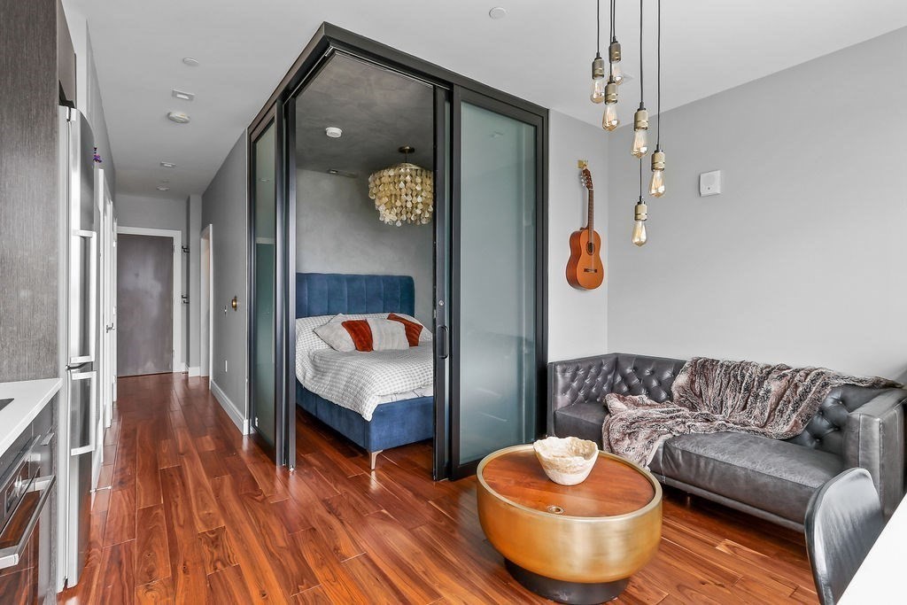 99 Sumner Street, Unit 623 Boston, MA 02128 - Photo 5 of 15 a living room with furniture and a table