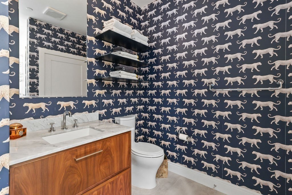 99 Sumner Street, Unit 623 Boston, MA 02128 - Photo 8 of 15 a bathroom with a sink toilet and mirror