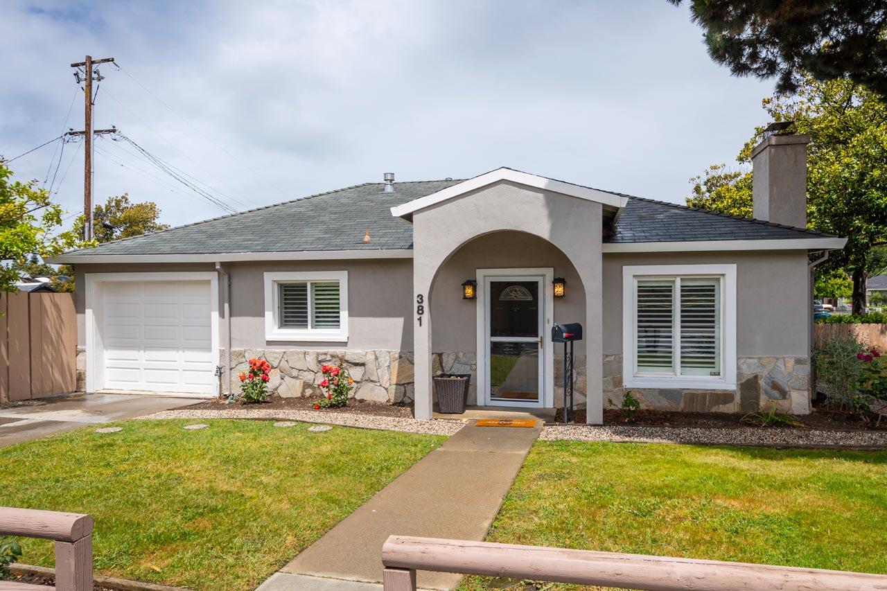a front view of house with yard and outdoor seating