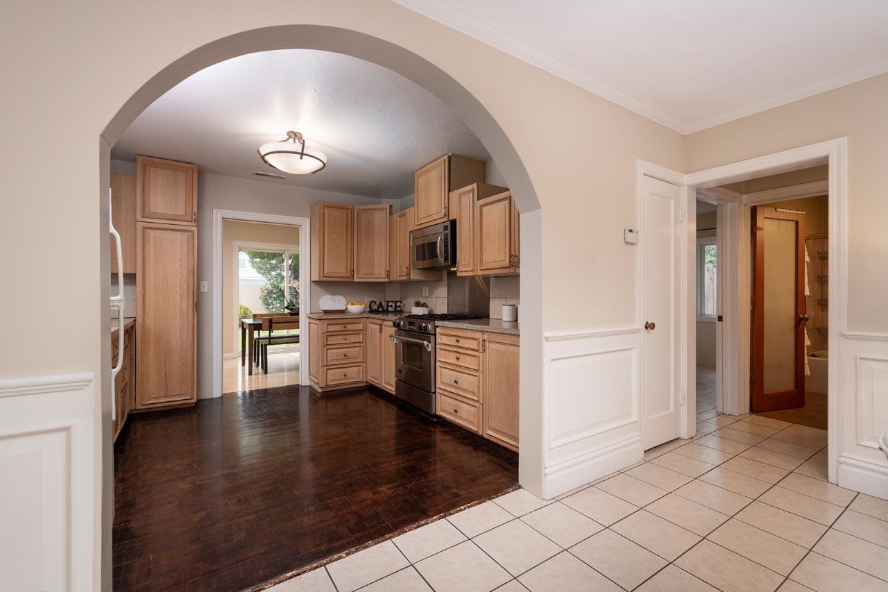 381 Old County Road San Carlos, CA 94070 - Photo 11 of 23 a kitchen with granite countertop white cabinets and stainless steel appliances