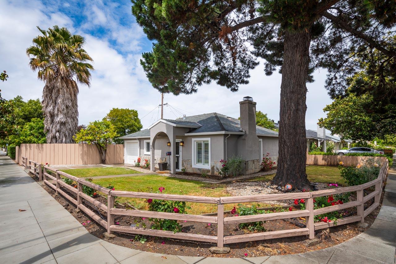 381 Old County Road San Carlos, CA 94070 - Photo 3 of 23 a front view of a house with a garden and trees