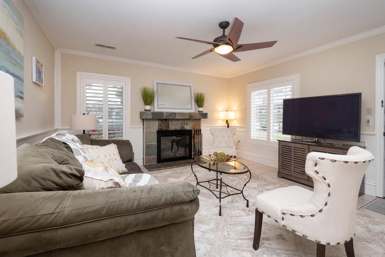 381 Old County Road San Carlos, CA 94070 - Photo 6 of 23 a living room with furniture a flat screen tv and a fireplace