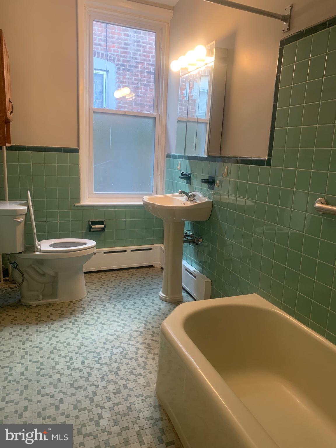 2387 Orthodox Street Philadelphia, PA 19137 - Photo 11 of 13 a bathroom with a sink and a bathtub