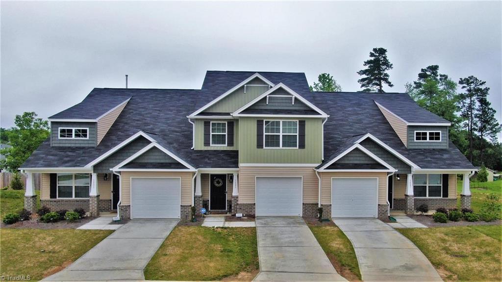 3885 Copperfield Court High Point, NC 27282 - Photo 1 of 30 Middle Unit is the one, small covered stoop, garage and decent driveway, plus there is extra parking in front of this unit